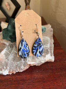 Polymer clay earrings crafted with the Mokume gane technique.